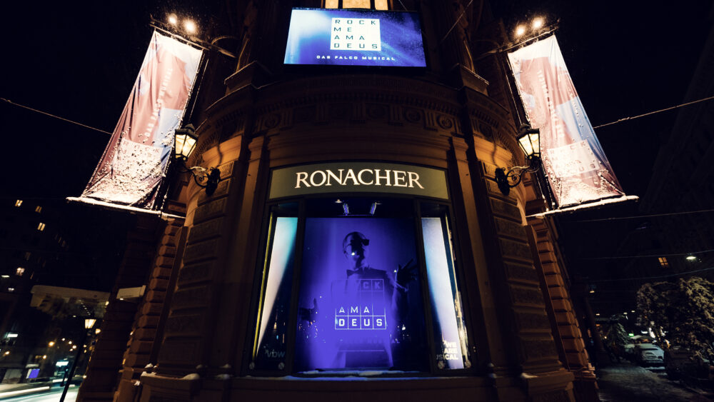 The beautifully illuminated entrance of the Ronacher Theater.