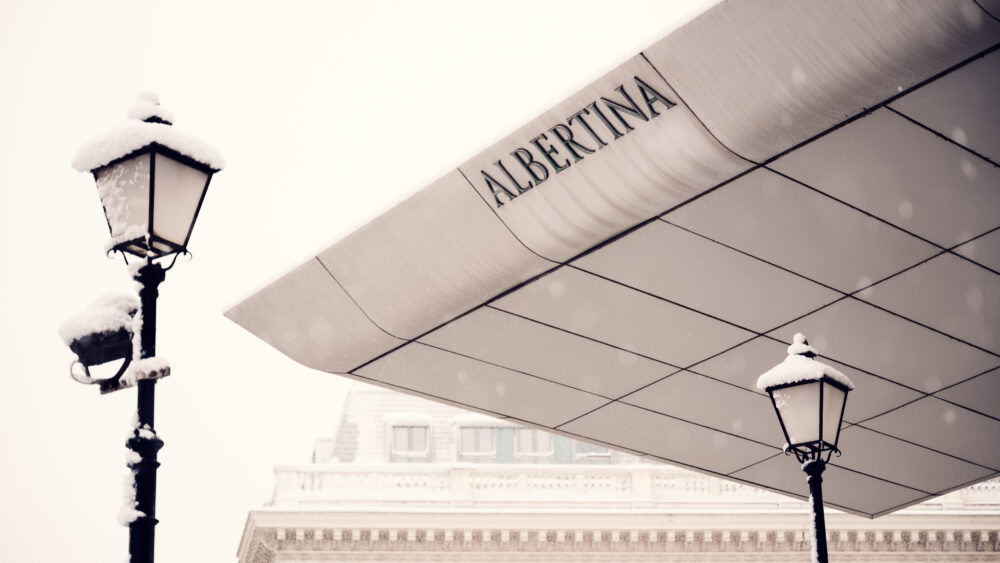 Modern roof extension of Albertina Museum with a streetlamp in Vienna.